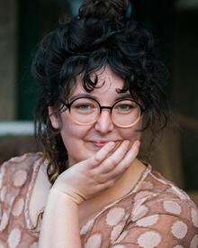 Lesley Darling with glasses and her piled on top of her head.